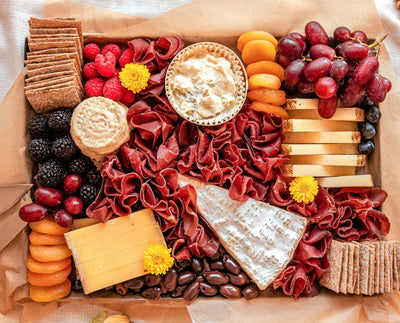 Le Signature cheese board that features 5 exquisite cheeses for 6-8 people