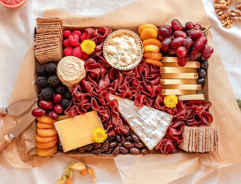 Le Signature cheese board that features 5 exquisite cheeses for 6-8 people