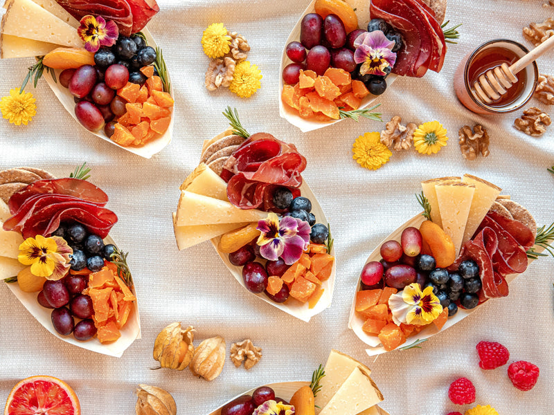 five Single-Serve Graze Boats platters