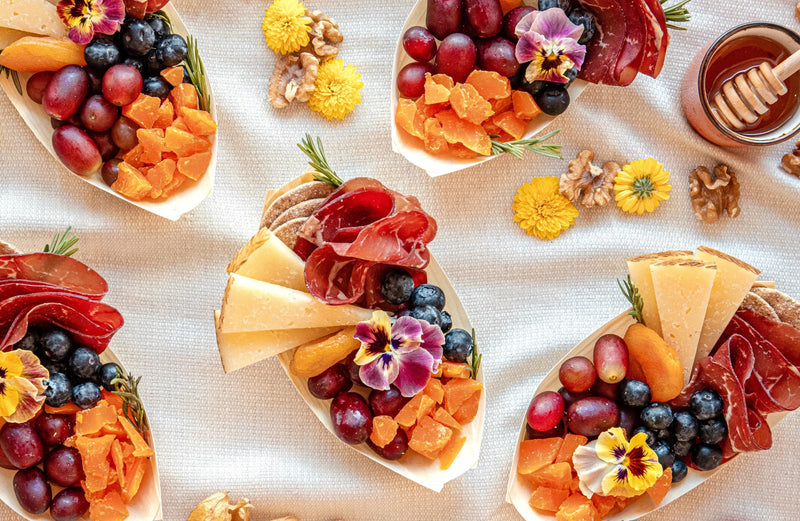 five Single-Serve Graze Boats platters