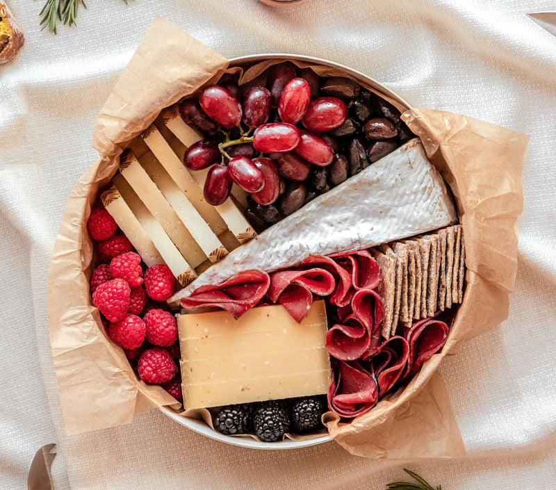 Le Mini Signature cheese board that features 3 of the finest cheeses for 2-4 people